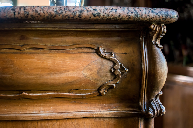 Antique walnut chest with carved rococo detail and pink granite marble top